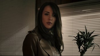 Movie still from “Hellraiser: Judgment” (2018), directed by Gary J. Tunnicliffe – A woman with long black hair wearing a leather jacket; Close Up shot, Low angle