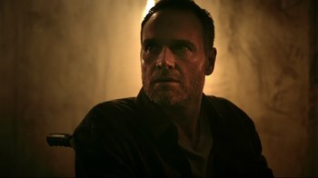 Movie still from “Hellraiser: Judgment” (2018), directed by Gary J. Tunnicliffe – A person looking at the camera; Close Up shot, Low angle