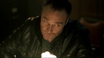 Movie still from “Hellraiser: Judgment” (2018), directed by Gary J. Tunnicliffe – A person wearing a leather jacket; Close Up shot, Low angle