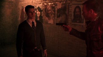 Movie still from “Hellraiser: Judgment” (2018), directed by Gary J. Tunnicliffe – A man holding a gun in front of another man; Medium shot, Over the shoulder angle