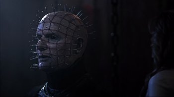 Movie still from “Hellraiser: Judgment” (2018), directed by Gary J. Tunnicliffe – A person wearing a mask with spikes on it; Close Up shot, Low angle