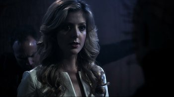 Movie still from “Hellraiser: Judgment” (2018), directed by Gary J. Tunnicliffe – A beautiful woman with long blonde hair; Close Up shot, Over the shoulder angle