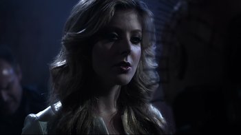 Movie still from “Hellraiser: Judgment” (2018), directed by Gary J. Tunnicliffe – A beautiful woman with long blonde hair; Close Up shot, Over the shoulder angle