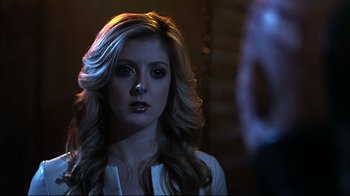 Movie still from “Hellraiser: Judgment” (2018), directed by Gary J. Tunnicliffe – A woman with long blonde hair looking into a mirror; Close Up shot, Over the shoulder angle