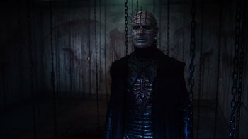Movie still from “Hellraiser: Judgment” (2018), directed by Gary J. Tunnicliffe – A man dressed as pinhead from hellraiser; Medium shot, Low angle