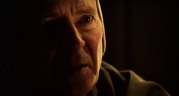 Movie still from “Henry V” (1989), directed by Kenneth Branagh – An old man with a beard and a black hat; Close Up shot, Low angle