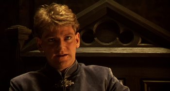 Movie still from “Henry V” (1989), directed by Kenneth Branagh – A person wearing a jacket; Close Up shot, Low angle