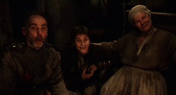 Movie still from “Henry V” (1989), directed by Kenneth Branagh – A group of people that are sitting in a room; Medium shot, High angle