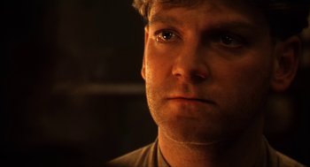 Movie still from “Henry V” (1989), directed by Kenneth Branagh – A man's face in the dark; Close Up shot, Low angle