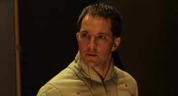 Movie still from “Henry V” (1989), directed by Kenneth Branagh – A person wearing headphones; Close Up shot, High angle