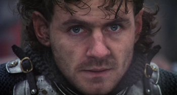 Movie still from “Henry V” (1989), directed by Kenneth Branagh – A man's face with a beard; Close Up shot, Low angle