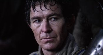 Movie still from “Henry V” (1989), directed by Kenneth Branagh – A person wearing a jacket; Close Up shot, Over the shoulder angle