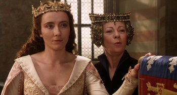 Movie still from “Henry V” (1989), directed by Kenneth Branagh – Two women in medieval garb looking at each other; Close Up shot, Over the shoulder angle