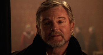 Movie still from “Henry V” (1989), directed by Kenneth Branagh – A person wearing a jacket; Close Up shot, Over the shoulder angle