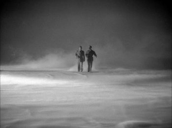 Movie still from “Here Comes Mr. Jordan” (1941), directed by Alexander Hall – Two people standing in the middle of a foggy field; Extreme Wide shot, High angle