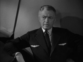 Movie still from “Here Comes Mr. Jordan” (1941), directed by Alexander Hall – An older man wearing a suit and tie; Close Up shot, Low angle