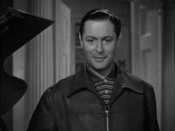 Movie still from “Here Comes Mr. Jordan” (1941), directed by Alexander Hall – A black and white photo of a man in a leather jacket; Close Up shot, Low angle