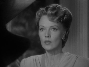 Movie still from “Here Comes Mr. Jordan” (1941), directed by Alexander Hall – An old photo of an older woman in a white dress; Close Up shot, Low angle