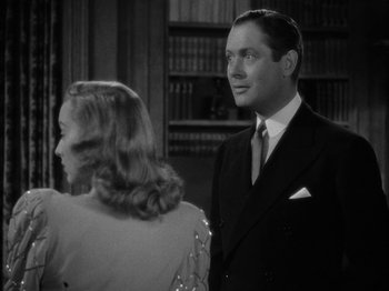 Movie still from “Here Comes Mr. Jordan” (1941), directed by Alexander Hall – A black and white photo of a man and a woman; Close Up shot, Over the shoulder angle