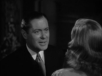 Movie still from “Here Comes Mr. Jordan” (1941), directed by Alexander Hall – A black and white photo of a man and a woman talking; Close Up shot, Over the shoulder angle