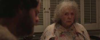 Movie still from “Hesher” (2010), directed by Spencer Susser – An older woman looking at a younger man; Close Up shot, Over the shoulder angle
