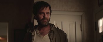 Movie still from “Hesher” (2010), directed by Spencer Susser – A person with a beard; Close Up shot, Over the shoulder angle