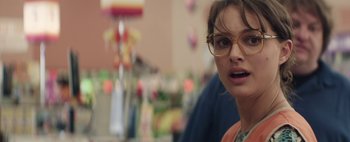 Movie still from “Hesher” (2010), directed by Spencer Susser – A person wearing glasses; Close Up shot, Over the shoulder angle