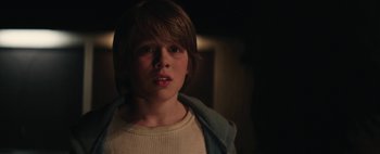 Movie still from “Hesher” (2010), directed by Spencer Susser – A young boy is looking into the camera; Close Up shot, Over the shoulder angle