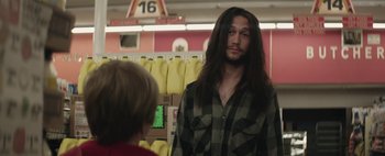 Movie still from “Hesher” (2010), directed by Spencer Susser – A man with long hair standing next to a boy; Medium shot, Over the shoulder angle