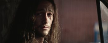 Movie still from “Hesher” (2010), directed by Spencer Susser – A person with long hair; Close Up shot, Over the shoulder angle