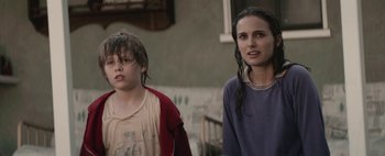 Movie still from “Hesher” (2010), directed by Spencer Susser – Two young people standing next to each other outside; Close Up shot, Over the shoulder angle