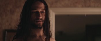 Movie still from “Hesher” (2010), directed by Spencer Susser – A person with long hair; Close Up shot, Over the shoulder angle