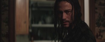 Movie still from “Hesher” (2010), directed by Spencer Susser – A person with long hair; Close Up shot, Over the shoulder angle