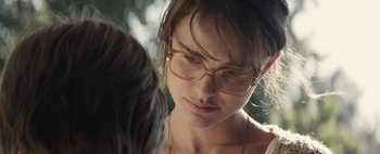 Movie still from “Hesher” (2010), directed by Spencer Susser – A person wearing glasses; Close Up shot, Over the shoulder angle