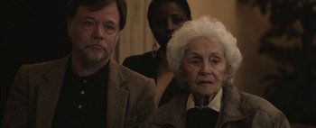 Movie still from “Hesher” (2010), directed by Spencer Susser – An older woman and a younger man standing next to each other; Close Up shot, Over the shoulder angle