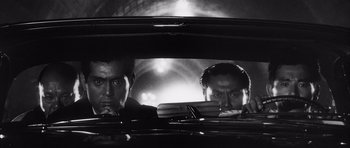 Movie still from “High and Low” (1963), directed by Akira Kurosawa – A black and white photo of two men in a car; Close Up shot, Low angle