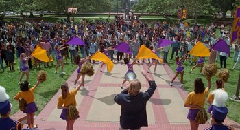 Movie still from “Higher Learning” (1995), directed by John Singleton – A group of people are dancing on the ground; Extreme Wide shot, High angle
