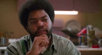 Movie still from “Higher Learning” (1995), directed by John Singleton – A person with his hand under his chin; Close Up shot, Over the shoulder angle