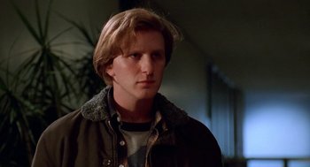 Movie still from “Higher Learning” (1995), directed by John Singleton – A man with long blonde hair wearing a brown jacket; Close Up shot, Low angle
