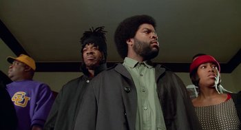 Movie still from “Higher Learning” (1995), directed by John Singleton – A couple of men standing next to each other; Medium shot, Low angle