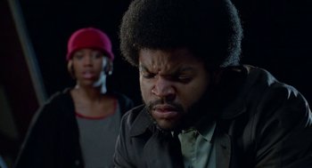 Movie still from “Higher Learning” (1995), directed by John Singleton – A man and a woman are looking at each other; Close Up shot, Low angle