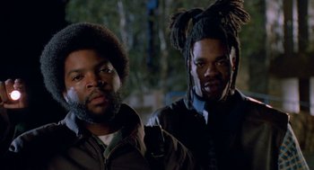 Movie still from “Higher Learning” (1995), directed by John Singleton – Two men standing next to each other in the dark; Close Up shot, Low angle