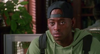 Movie still from “Higher Learning” (1995), directed by John Singleton – A person wearing a hat; Close Up shot, High angle