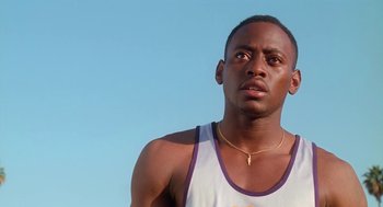 Movie still from “Higher Learning” (1995), directed by John Singleton – A person wearing a tank top; Close Up shot, Low angle