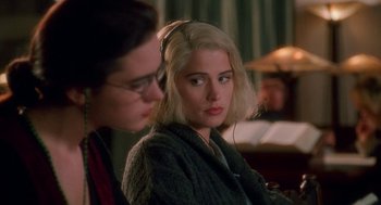Movie still from “Higher Learning” (1995), directed by John Singleton – A woman with blonde hair sitting next to another woman; Close Up shot, Over the shoulder angle