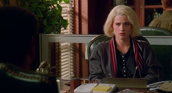 Movie still from “Higher Learning” (1995), directed by John Singleton – A woman sitting at a desk in front of a window; Medium shot, Over the shoulder angle