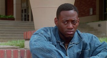 Movie still from “Higher Learning” (1995), directed by John Singleton – A person wearing a jean jacket; Close Up shot, High angle