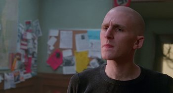 Movie still from “Higher Learning” (1995), directed by John Singleton – A man with bald head looking to his left; Close Up shot, Low angle