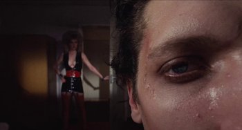 Movie still from “Highlander” (1986), directed by Russell Mulcahy – A woman in a black dress standing in front of a man; Extreme Close Up shot, Low angle