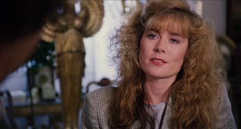 Movie still from “Highlander” (1986), directed by Russell Mulcahy – A person with long hair; Close Up shot, Over the shoulder angle